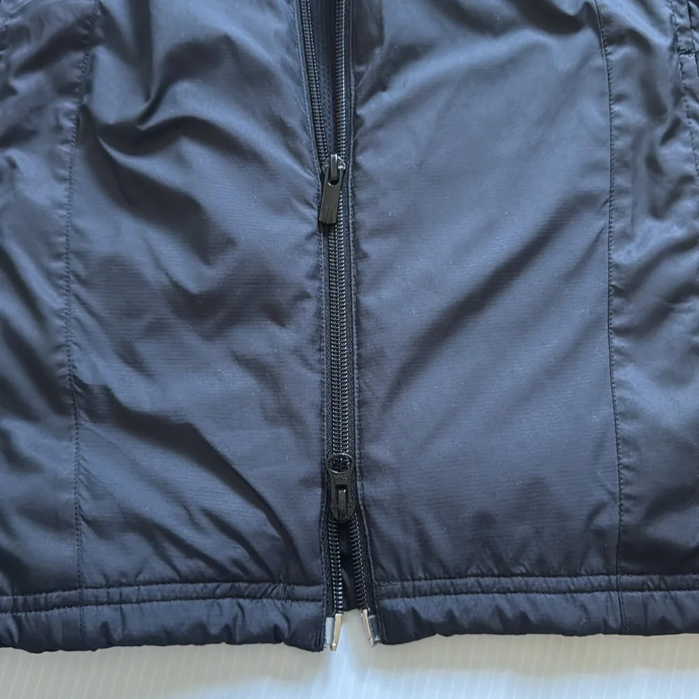 Vintage Adidas black, orange & white windbreaker jacket.  Men’s size small